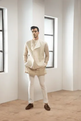 Ivory textured jacket with  off white kurta and white pants.