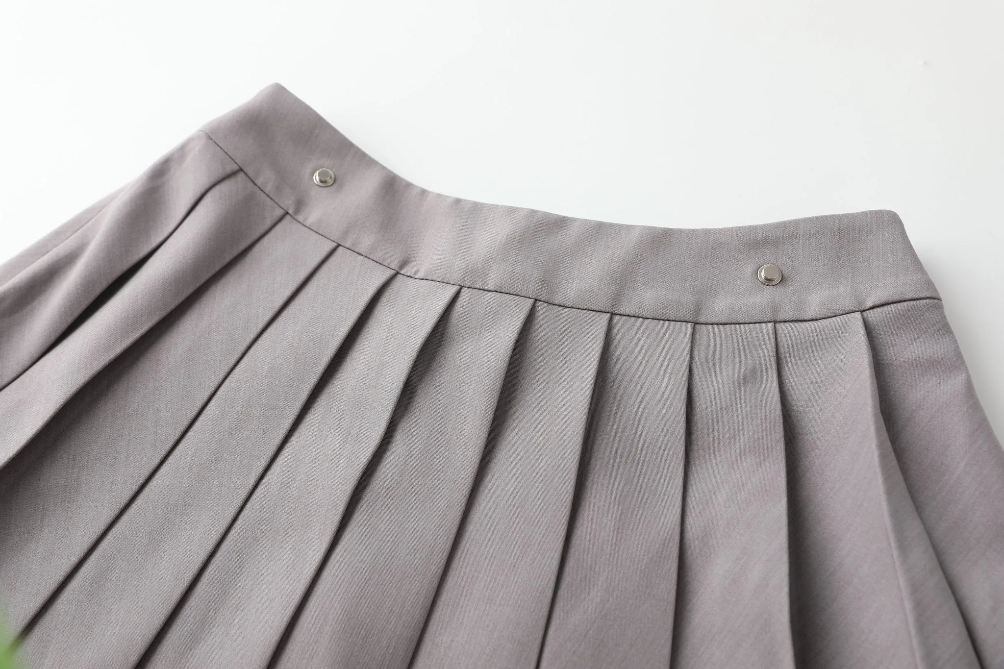 Slant Cut Back With Pleated Skirt